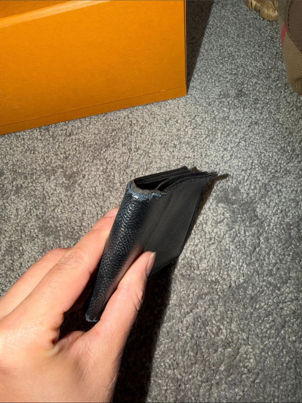 Louis Vuitton Black Leather Wallet with Pebbled Texture